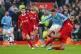 Liverpool's Virgil van Dijk challenges Manchester City's Phi