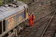 ​​Railway workers at the scene of a freight train derail