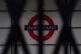 Sign for the London Underground seen through the closed shut