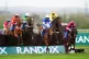 Conflated ridden by Jack Kennedy (right) leads on lap one of