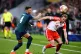 Arsenal's Ben White (left) and Bayern Munich's Harry Kane ba