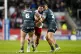 St Helens' Konrad Hurrell (centre) is tackled by Huddersfiel