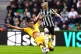 Sheffield United's Mason Holgate (left) challenges Newcastle