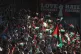 Football fans wave flags before the Bohemians Women friendly