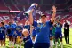 Chelsea manager Emma Hayes celebrates with the trophy after 