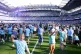 Manchester City fans invade the pitch following Premier Leag