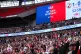 A screen displays a VAR result during the League Two play-of