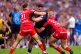 Leinster's James Lowe is tackled during the Champions Cup fi