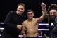 Jack Catterall (centre) celebrates victory with promotor Edd