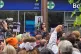 Faiza Shaheen addresses supporters outside a supermarket in 