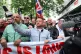 Tommy Robinson (centre), whose real name is Stephen Yaxley L