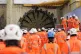 HS2 workers looking on as the boring machine Cecelia breaks 