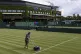 Ground staff paint lines on Court 4 in front of the Clubhous