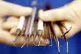 A dental nurse holding dental instruments