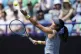Britain's Emma Raducanu serves during her match against USA'