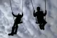 Children enjoying playing on swings in a park near Ashford, 