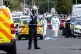 Forensic officers on Hart Street in Southport, Merseyside, w