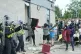 A chair is thrown at police officers as trouble flares durin