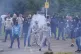 A firework is thrown towards police during an anti-immigrati