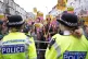 Demonstrators and police officers at an anti-racism protest 