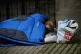 A homeless couple sleep on a corner in Belfast city centre, 