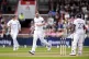 England's Chris Woakes celebrates taking a wicket of Sri Lan