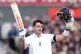 England's Jamie Smith celebrates after reaching 100 runs and