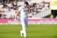 England's Mark Wood leaves the field after picking up an inj