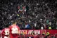 Liverpool fans celebrate in the stands following the opening