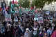 People take part in a Palestine Solidarity Campaign rally on