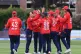 England players celebrate after Ireland's Aimee Maguire bowl