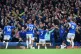Everton's Dwight McNeil (centre) celebrates scoring their si
