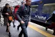 Commuters and travellers at Edinburgh's Waverley Station, Ma