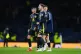 Scotland's Nicky Devlin (centre) reacts after the UEFA Natio