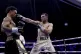 Jack Catterall (right) lands a punch on Regis Prograis (left