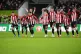 Brentford players celebrate after goalkeeper Mark Flekken sa