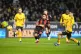 Bournemouth's Justin Kluivert (centre) attempts a shot on go