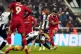 Liverpool's Mohamed Salah scores their side's third goal of 