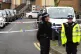 Police officers at the scene on Gifford Road, Brent, after a