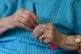 An elderly woman at Rowheath House retirement home in Birmin