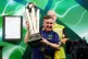 Luke Littler lifts The Sid Waddell Trophy after winning the 