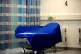 An empty patient bed on an NHS hospital ward in England
