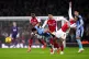 Tottenham Hotspur's Dominic Solanke is challenged by Arsenal