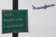 A plane flies past a 