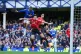 Everton's Beto heads towards goal under pressure from Manche