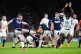 Scotland's Finn Russell (left) clears under pressure from En