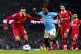 Liverpool's Trent Alexander-Arnold (left) battle for the bal