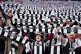 Newcastle United fans hold up matching scarves before the Le