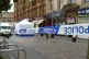 A police cordon outside shops after a violent incident