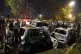 Security officials examine the site of an explosion that cau